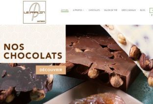 Accueil du site le-pralin.com avec une photo de chocolat.